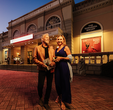 couple standing outside asolo theater in sarasota
